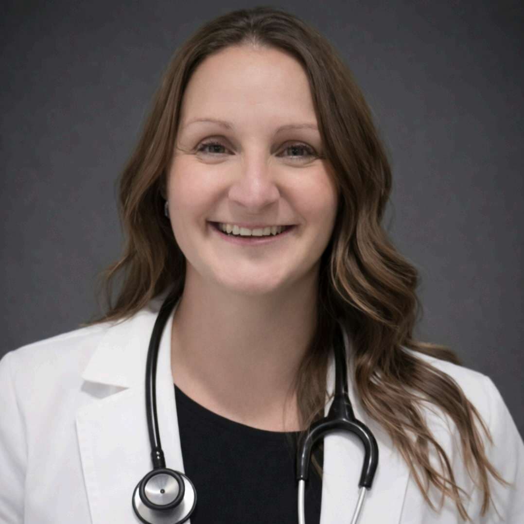 Jody Gosnell, FNP-BC, Board Certified Family Nurse Practitioner at Heartfelt Medical Services in Belvidere, Illinois, wearing a white coat and stethoscope